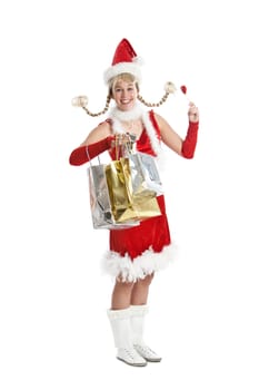 Pretty young girl in santa outfit having fun while shopping