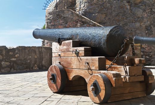 old iron cannon pointing out to sea in Camogli, Italy