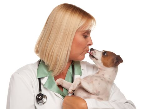 Attractive Female Doctor Veterinarian with Small Puppy Isolated on a White Background.