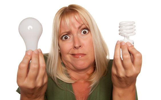 Funny Faced Woman Holds Energy Saving and Regular Light Bulbs Isolated on a White Background.