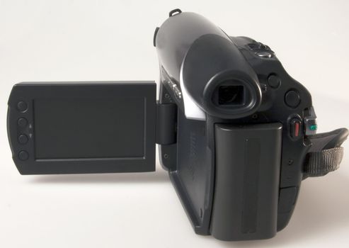 Gray and black camcorder over a gray background