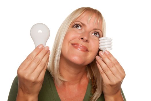 Smiling Woman Holds Energy Saving and Regular Light Bulbs Isolated on a White Background.