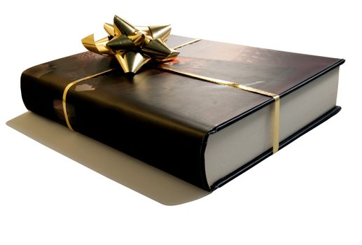 An isolated brown book with a golden ribbon for a gift