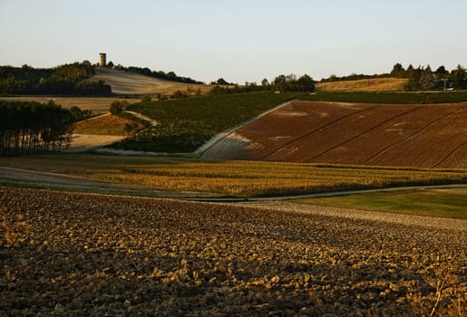 Landscape of hills and fields at the sunset