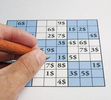 Male man playing sudoku with dollars symbol in it