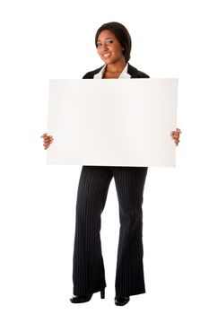 Beautiful smiling successful corporate business woman pitching an idea presenting blank whiteboard advertisement, isolated.