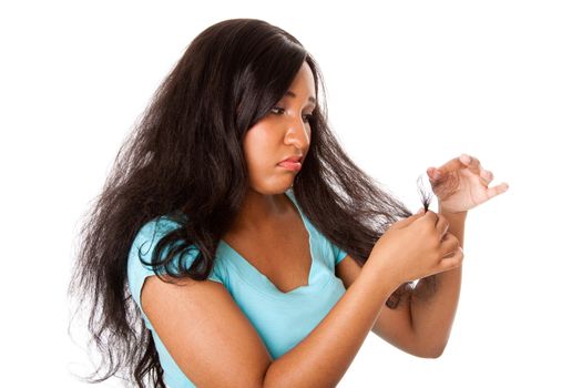 Teenage girl sad about her frizzy hair with split hair tips due to bad haircare, isolated.