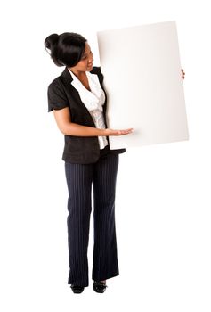 Beautiful smiling successful corporate business woman pitching an idea presenting blank whiteboard, isolated.