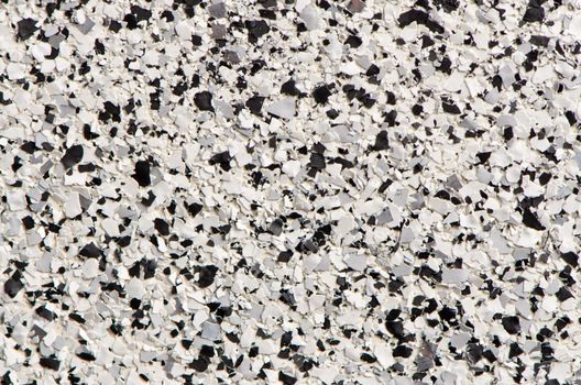 Artificial granite-like plastic texture.