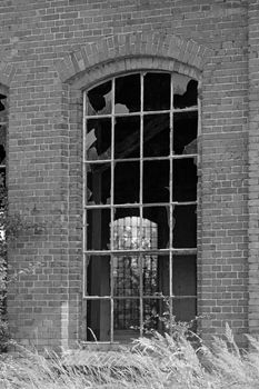 Broken window of the old abandoned railway depot
