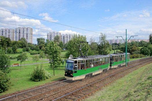 Landscape with a tram line and blocks of flats
