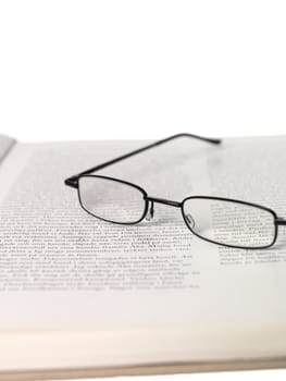 Reading-glasses in a spread book