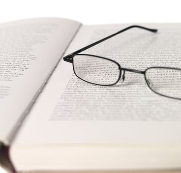 Reading-glasses in a spread book
