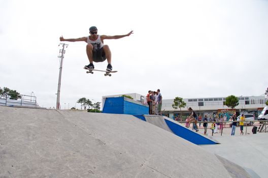 ILHAVO, PORTUGAL - AUGUST 13: Nuno Alcaide on a transfer ollie during the Skate Open Ilhavo on August 13, 2011 in Ílhavo, Portugal.