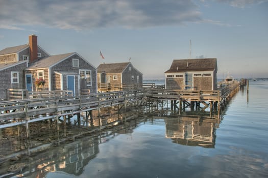 A group of houses above the water on Nantucket Shore, MA