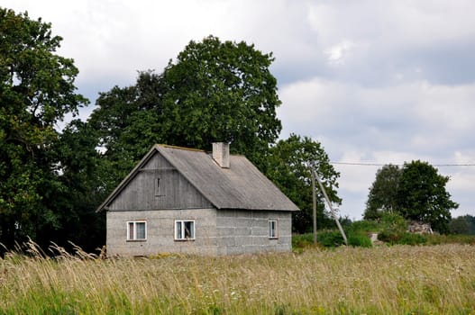 Small apartment house on border of a field