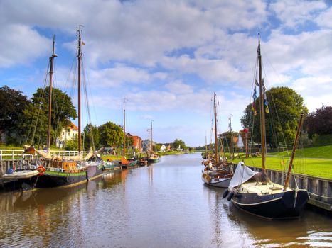 historic ships in the old harbor of carolinensiel, germany