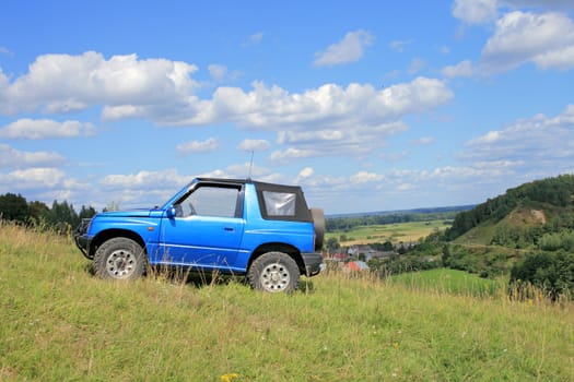 Off-road. 4x4 jeep at the top of a hill
