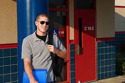 Young college students outside of a classroom at a public university