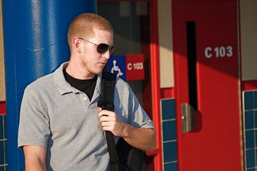 Young college students outside of a classroom at a public university