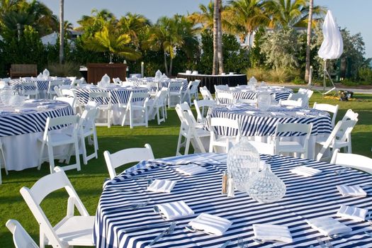 Luxury resort evening dinner reception area with tables and settings