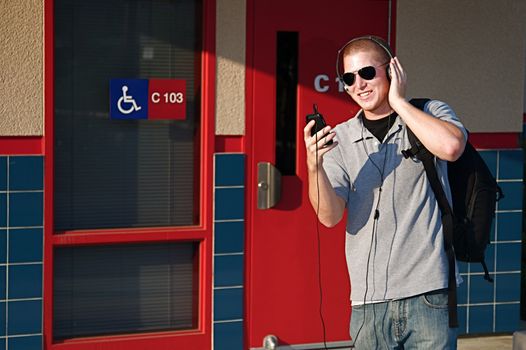 Young college students outside of a classroom at a public university