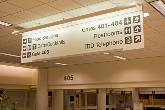 Direction signs in an airport terminal for travelers