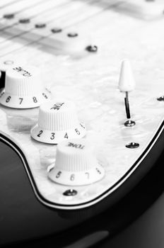 Detail of electric red and white guitar