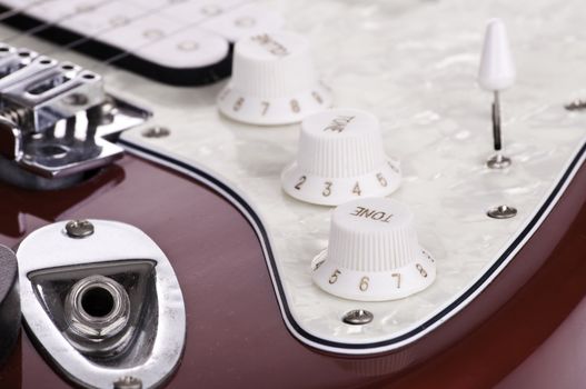 Detail of electric red and white guitar