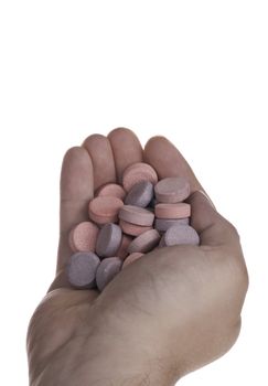 Handful of Antacid tablets on a white background