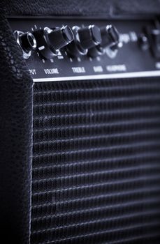 Knobs of different functions on a guitar amp