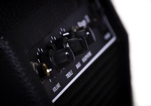 Knobs of different functions on a guitar amp