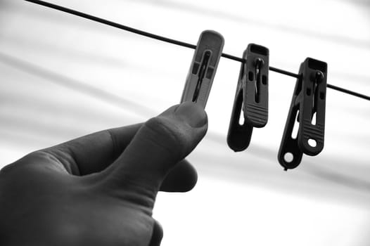 a few cloth pegs hanging on a piece of string