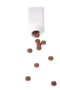 A white pill bottle with red generic pills on a white background.