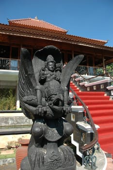 statue of wayang figure with bird and prince that made from solid rock