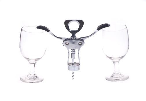 A background of empty glasses and a corkscrew.