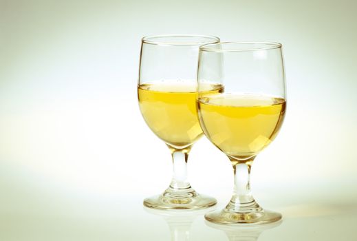 Glass of white wine Isolated on a white background.