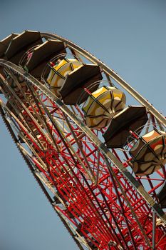giant farris wheel against blue sky background