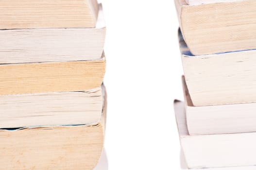 Two stacks of books on white background