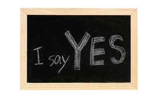 Blackboard writing white words of "I say Yes".