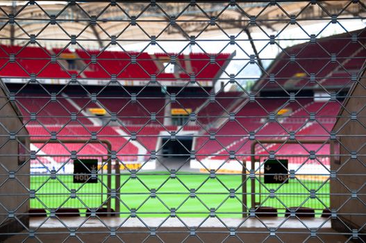 View on a soccer stadium through locked gate