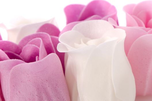 Pink, purple and white beautiful luxury soap roses background.