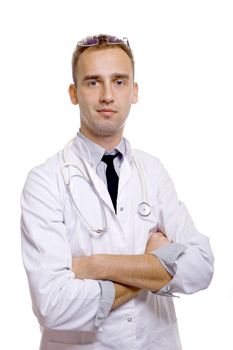 young doctor with arms crossed and stethoscope