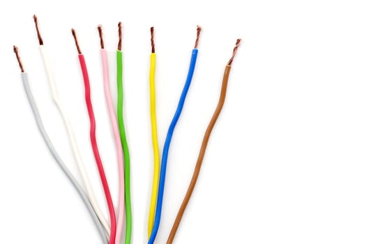 Coloured electric wires over a white background