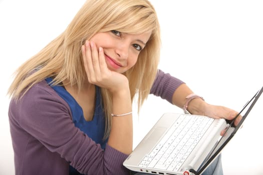 Smiling girl connected with her laptop on a white background