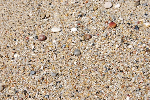 beautiful background with little stones at the beach