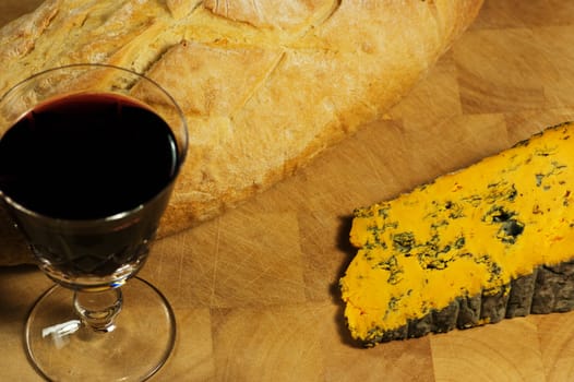 Bread and cheese with a glass of french red wine