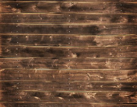 Close up of a wood fence with nails