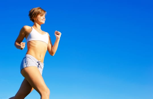 Fit young woman working out, from a complete series of photos.