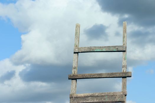 Ladder removed against the cloudy sky in the afternoon